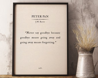 May include: A black framed print with a white background featuring a quote from J.M. Barrie's Peter Pan: "Never say goodbye because goodbye means going away and going away means forgetting." The quote is centered on the print with the title "Peter Pan" and author "J.M. Barrie" above it. The number "125." is at the bottom of the print.