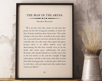 May include: Black and white printable wall art featuring a quote by Theodore Roosevelt about the "Man in the Arena". The quote is printed in a vintage style font on a white background with a black border.