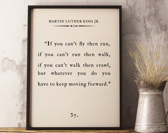 May include: A framed black and white print with a quote by Martin Luther King Jr. The quote reads, "If you can't fly then run, if you can't run then walk, if you can't walk then crawl, but whatever you do you have to keep moving forward." The number 37 is printed below the quote.