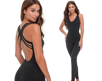 May include: Black one-piece jumpsuit with a criss-cross back design. The jumpsuit has a V-neck and a fitted silhouette.