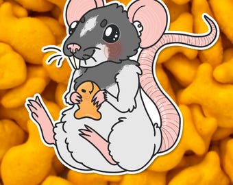 May include: A sticker featuring a cartoon rat with gray and white fur, pink ears and tail, holding a small gingerbread man. The background is filled with yellow goldfish crackers, and the text "w. hutchison art" is at the bottom.