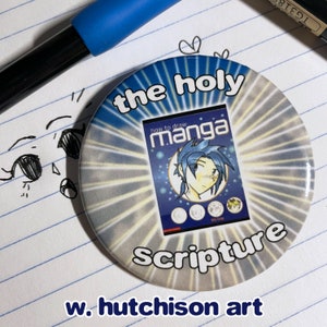 May include: A round button with a white and blue background. The button has the text "the holy scripture" and a picture of a book titled "how to draw manga".