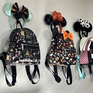 Mickey Ear display - Head Band and Backpack loungefly Backpack display