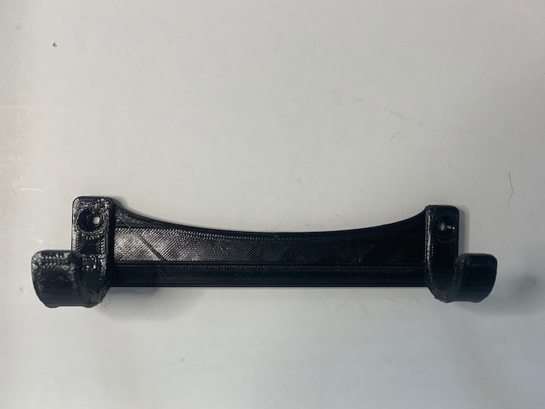 May include: A set of three ceramic mugs with a speckled, matte finish. The mugs are in shades of cream, light gray, and dark gray. Each mug has a simple, minimalist design, perfect for coffee or tea.