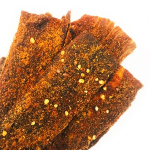 Flaming Beef • Beef Jerky Chips • Addictive • Bold Flavor • Crunchy • Spicy