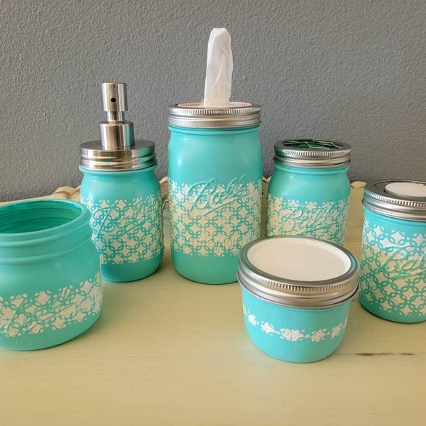 Mason jar bathroom accessories.  Aqua, mint color with cream color patterns.