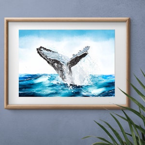 May include: A watercolor painting of a whale tail breaching the surface of the ocean. The water is a vibrant blue and the whale is gray with black markings. The sky is a light blue with white clouds.