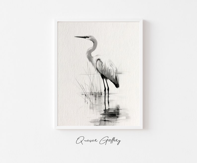 May include: Black and white illustration of a heron standing in water with reeds in the background. The illustration is framed in a white frame.