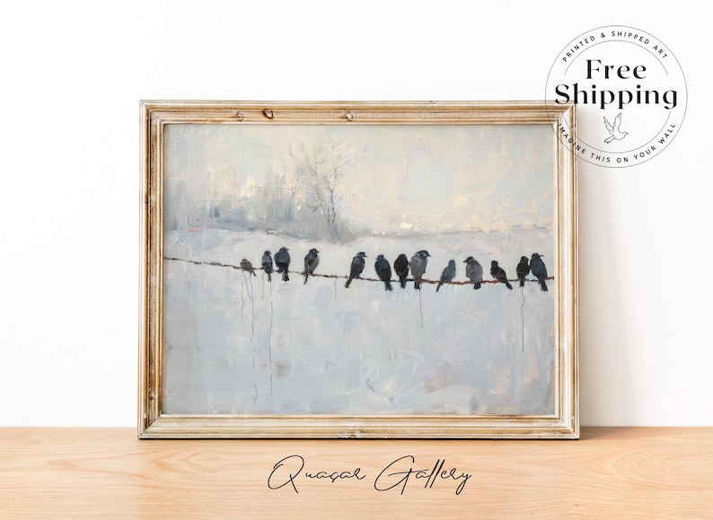 May include: A framed painting depicts a row of birds perched on a wire against a muted, snowy landscape. The artwork features a neutral color palette with a distressed, light-colored wooden frame. The painting is signed "Quasar Gallery".