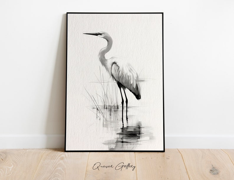 May include: Black and white watercolor painting of a great egret standing in a marsh. The bird is facing to the right and has its head tilted down. The background is a light gray.