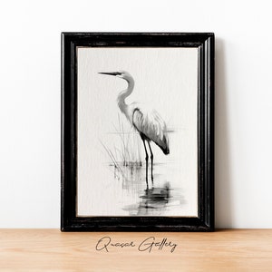 May include: Black and white watercolor painting of a great egret standing in a marsh. The bird is facing to the left and its reflection is visible in the water.