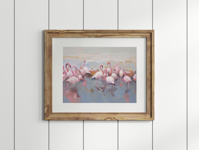 May include: A framed painting of a group of pink flamingos standing in a shallow body of water. The flamingos are reflected in the water, and the background is a soft, muted blue.