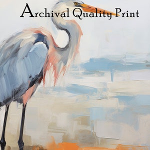 Puede incluir: Una pintura de una garza azul de pie en una playa con un fondo azul claro y blanco. El texto "Archival Quality Print" est&aacute; en la parte superior de la imagen.
