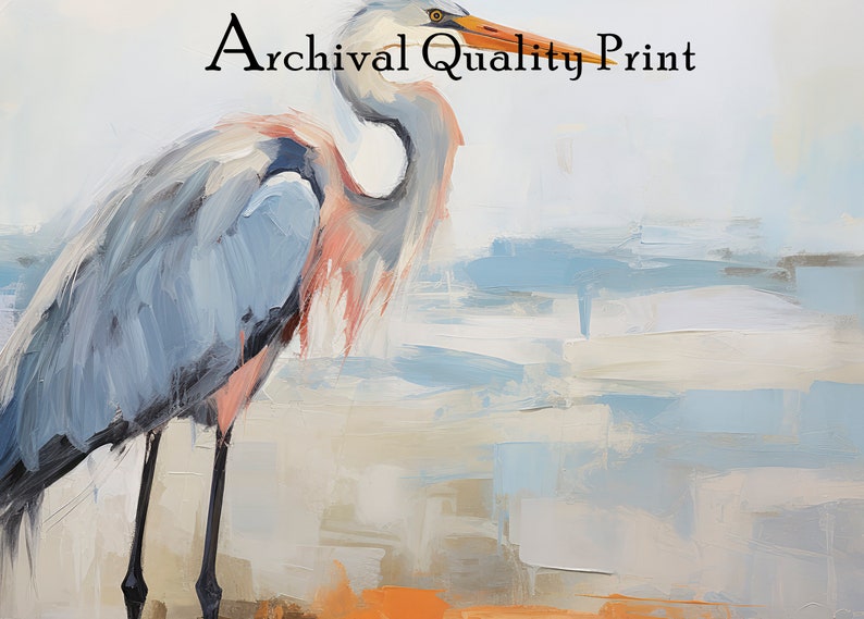 Puede incluir: Una pintura de una garza azul de pie en una playa con un fondo azul claro y blanco. El texto "Archival Quality Print" est&aacute; en la parte superior de la imagen.