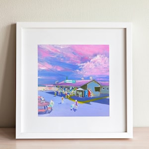 May include: A framed art print depicting a coastal scene with a building under a purple roof and a sign that reads "SAMMY'S". The sky is a mix of pink and blue hues, with people and tables in the foreground. The artwork is in a white frame.