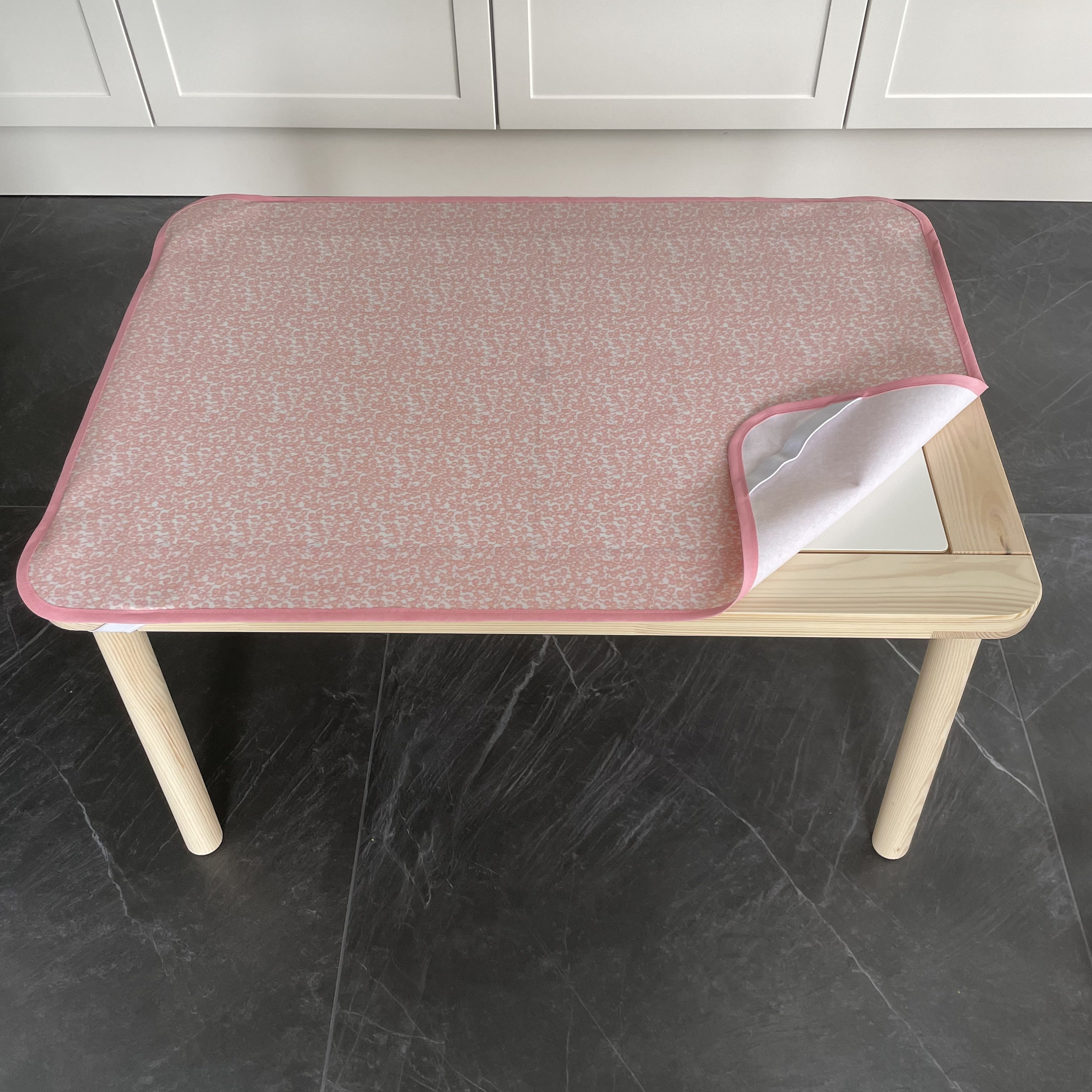 Oilcloth fitted Table Mat with elastic corner fastenings to fit IKEA FLISAT Sensory Table in PeachyPink design with Pink edging