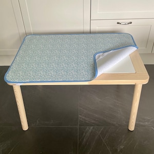 Oilcloth fitted Table Mat with elastic corner fastenings to fit IKEA FLISAT Sensory Table in AquaBlue design with blue edging