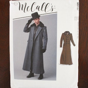 May include: McCall's sewing pattern for a long gray coat with a black fur collar. The pattern features a man wearing the coat, a top hat, and gloves. The pattern also includes a smaller illustration of a brown coat.