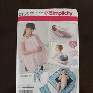 May include: Simplicity sewing pattern number 2165 for a baby nursing cover, baby diaper cover, and baby blanket. The pattern includes instructions for making a nursing cover, diaper cover, and blanket. The pattern is designed by Teri.
