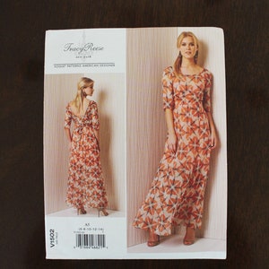 May include: A sewing pattern for a maxi dress with a floral print. The pattern is from Vogue Patterns and is designed by Tracy Reese. The pattern is for sizes 6-8-10-12-14.
