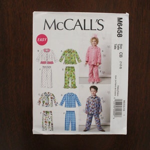 May include: A sewing pattern for children's pajamas. The pattern includes instructions for making pajamas with long sleeves and pants. The pattern is for sizes 1-2-3. The pattern is easy to follow and includes illustrations.