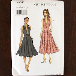 May include: A sewing pattern titled V9343 from Very Easy Vogue. The pattern features illustrations of two halter-neck dresses, one in gray and the other in pink. The size range is E5 (14-16-18-20-22). The pattern is designed and printed in the USA.