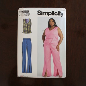 May include: Simplicity sewing pattern S9689 featuring a pink sleeveless top and matching pants with side slits. The pattern also includes a vest and blue pants. The size range is US 30W-38W.