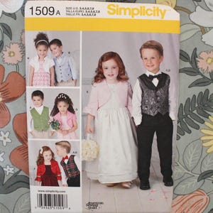 May include: A Simplicity 1509 sewing pattern envelope featuring illustrations of children wearing formal attire, including vests, bolero jackets, and dresses. The package displays sizes 3 through 8 and includes a barcode at the bottom.