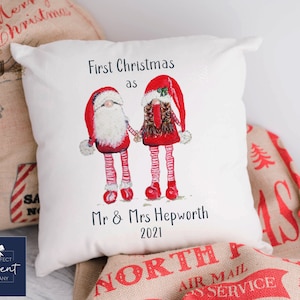 May include: White cushion with a red and white gnome couple illustration. The text reads "First Christmas as Mr & Mrs Hepworth 2021".