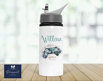 May include: White water bottle with a gray lid and a teal blue design. The design features a video game controller with flowers and the text "Willow Limited Edition Gamer Girl".