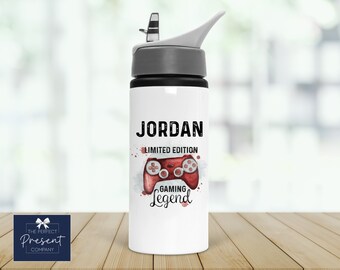 May include: White water bottle with a black lid and a gray cap. The bottle has a red and black watercolor design of a video game controller with the text "JORDAN LIMITED EDITION GAMING Legend".