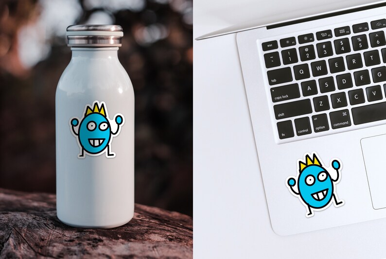 May include: A white stainless steel water bottle with a blue and yellow cartoon sticker of a smiling monster wearing a crown. The monster is raising its arms in the air.