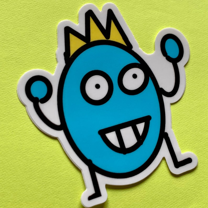 May include: A blue cartoon monster with a yellow crown, big eyes, and a toothy grin. The monster is waving with both arms.