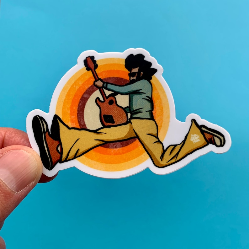 May include: A sticker of a cartoon person playing a guitar while running. The person is wearing brown pants and a blue shirt. The background is a retro-style orange and brown circle.