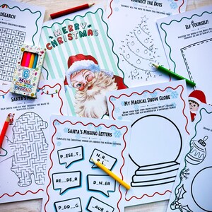 May include: A collection of Christmas-themed activity sheets, including a word search, connect-the-dots, and maze. A box of six mini colored pencils and a greeting card with Santa Claus are also visible. The sheets are decorated with festive borders.