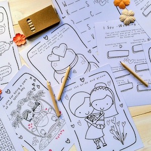 May include: A set of printable wedding activity sheets featuring a wedding cake, a bride and groom, a car, and a word search. The sheets are black and white and ready to be coloured.