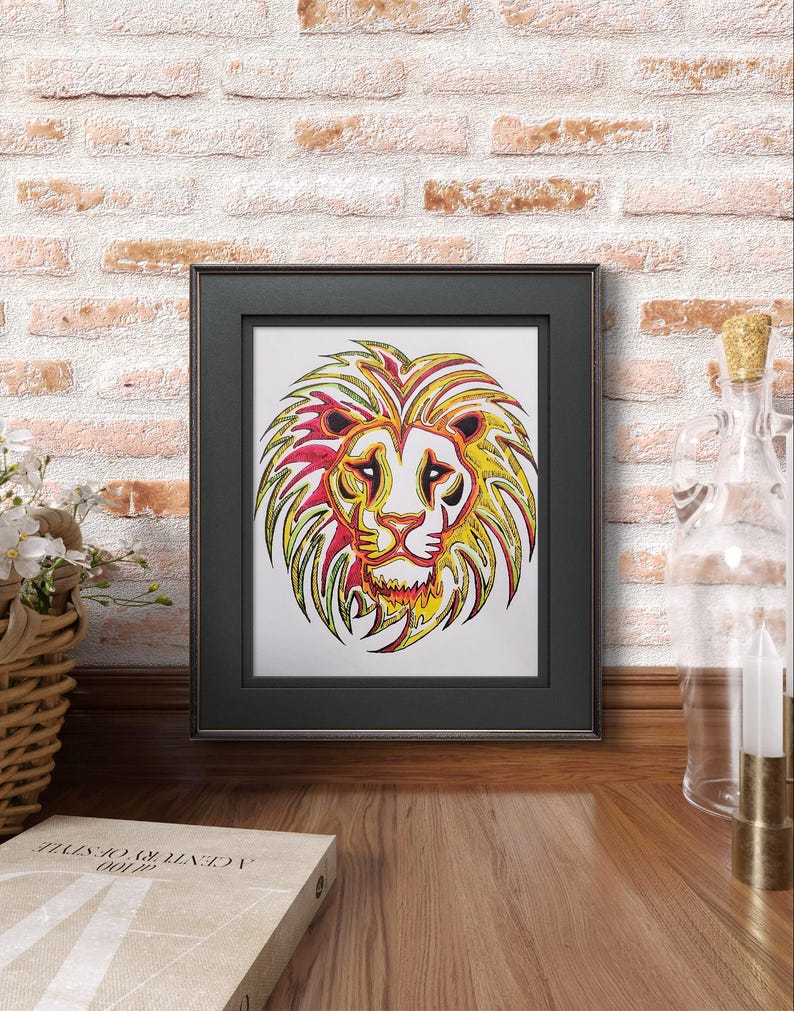 May include: A framed print of a colorful lion's head with yellow, red, and green lines. The lion's mane is stylized and the background is white.