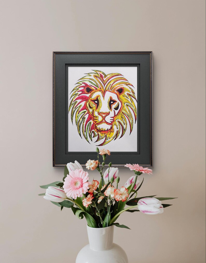 May include: A framed print of a colorful lion's head with a yellow, red, and green color scheme. The lion's mane is made up of intricate patterns and swirls.