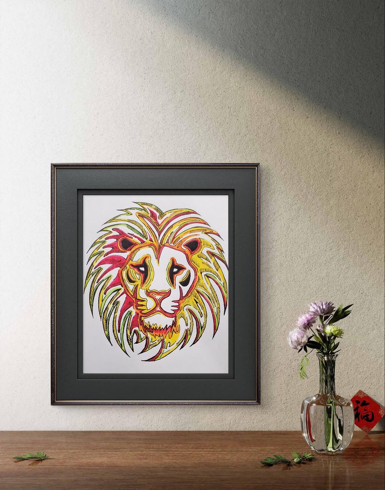 May include: A framed print of a colorful lion's head with yellow, red, and green lines. The lion's head is stylized and has a white background.