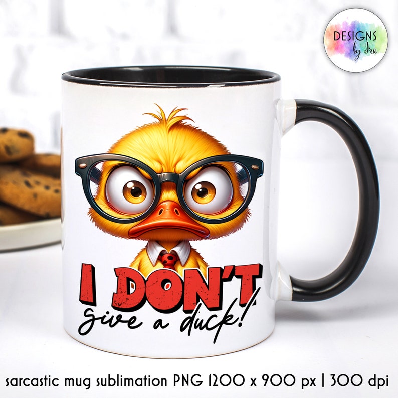 May include: White ceramic mug with a black handle. The mug features a cartoon illustration of a yellow duck wearing red-rimmed glasses and a red bow tie. The text "I DON'T give a duck!" is printed in red on the mug.