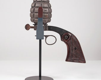 Honorable Discharge- Satirical pistol / grenade sculpture from Nemo Gould