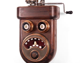 Spring motor powered kinetic assemblage robot face sculpture "Watchful"