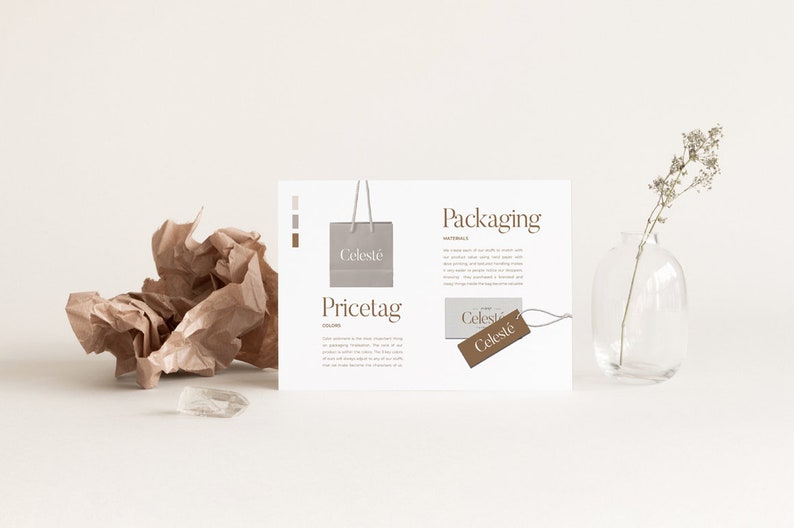 May include: A white card with the words "Packaging" and "Pricetag" printed on it. The card shows a mockup of a brown paper bag with the word "Celestie" printed on it. There is also a mockup of a brown paper price tag with the word "Celestie" printed on it.