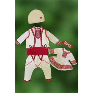 Folk Nouveau Costume. Bulgarian folk costume with belt and cap