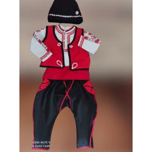 Folk Nouveau Costume. Bulgarian folk costume with belt and cap