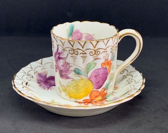 Hand painted 19th Century Dresden porcelain miniature demitasse cup and saucer with bright colour flowers