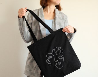 Hand embroidered abstract face tote bag, black canvas shopping bag, line art tote bag