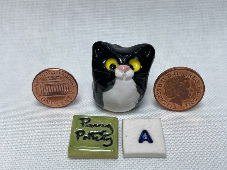 Miniature Ceramic Black & White Cats. Cute furry characters sold individually. Handmade by collected UK artist Penny Howarth A