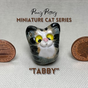Miniature Ceramic Tabby Cats. Cute Animal characters sold individually. Handmade by collected UK artist Penny Howarth