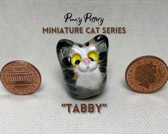 Miniature Ceramic Tabby Cats. Cute Animal characters sold individually. Handmade by collected UK artist Penny Howarth
